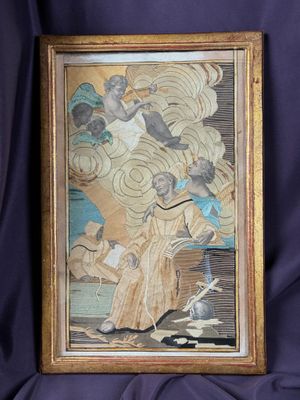 an old picture of a painting on a purple cloth