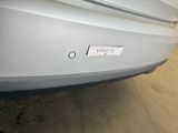 a close up of a car ' s bumper with a sticker on it