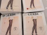 four pairs of black and white stockings are on display in a store