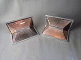 two pieces of silver and pink glitter in a box