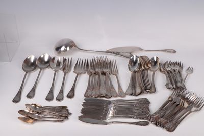 a lot of silver spoons and forks on the table