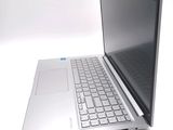 a laptop computer sitting on top of a white table