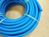 a close up of a blue hose on a table