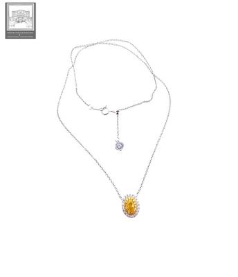 a necklace with a sunflower pendant on a chain