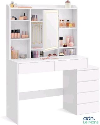 une photo d'un meuble-lavabo blanc avec un miroir et des tiroirs