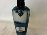 a blue and white vase sitting on a clear shelf