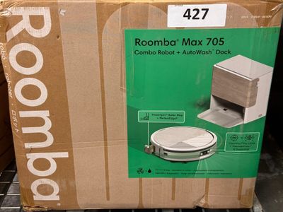 cardboard box with a picture of a roomba on top of it in a store