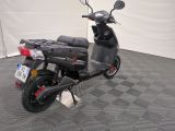a scooter that is parked in a garage
