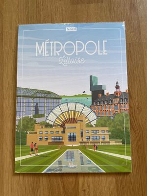 the front cover of a book on a wooden table