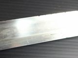 a large knife that is laying on top of a table