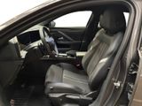 the interior of a car with the door open showing the driver ' s seat