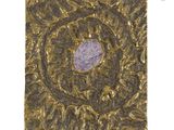 a close up of a square metal object with a purple stone in the center