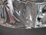 a glass of water with a toothbrush inside of it