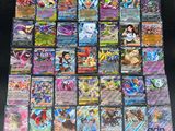 a large collection of pokemon cards are on a table
