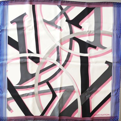 a close up of a square scarf with a design on it