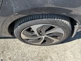 a close up of a car ' s tire on the street