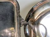 a silver plate with a mirror on top of it