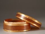 two rings sitting on top of each other on a table