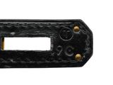 a close up of a black metal object on a white background