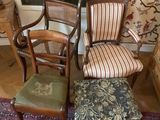 four chairs and a stool in a living room