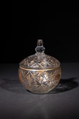 an image of a glass jar with a lid on a table
