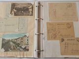 a binder with a lot of old postcards on it