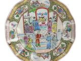 a plate with a picture of people on it