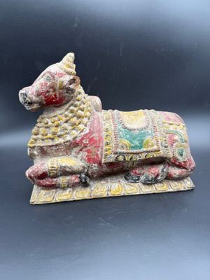 a close up of a figurine of a dog on a rug