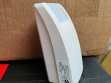 an image of a white electronic device on a box
