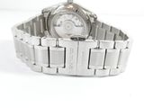 a close up of a wrist watch on a white surface