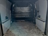 the back of a van with the door open and the back of the van with the door open