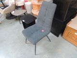 a chair that is sitting in the middle of a pile of furniture