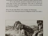 a black and white photo of a book with a picture of a mountain in the background