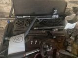 a suitcase full of tools sitting on top of a table