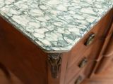 a marble top on a wooden cabinet in a room