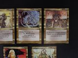 several cards are displayed on a table with a black background