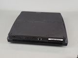 a black laptop computer sitting on a table with a mouse