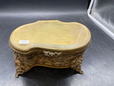 a gold table with a mirror on top of it