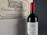 a bottle of wine that is sitting next to a box