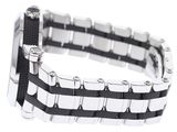 a black and white bracelet with a silver clasp on it