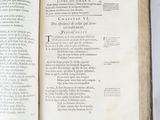 an open book on a white table with a black and white picture