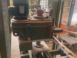 a picture of a machine that is working on a piece of wood