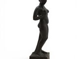 an image of a statue of a woman standing on top of a block