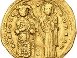 une pièce d'or portant l'image d'un homme et d'une femme