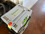 a cooler sitting on top of a cart on the floor