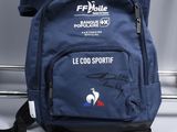the back of a blue backpack with a picture of a soccer player on it