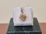 a small box with a gold leaf charm on it