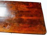 a wooden cutting board on a table with a white background
