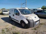 a white van that is parked in the dirt