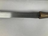 a knife that is laying on a table